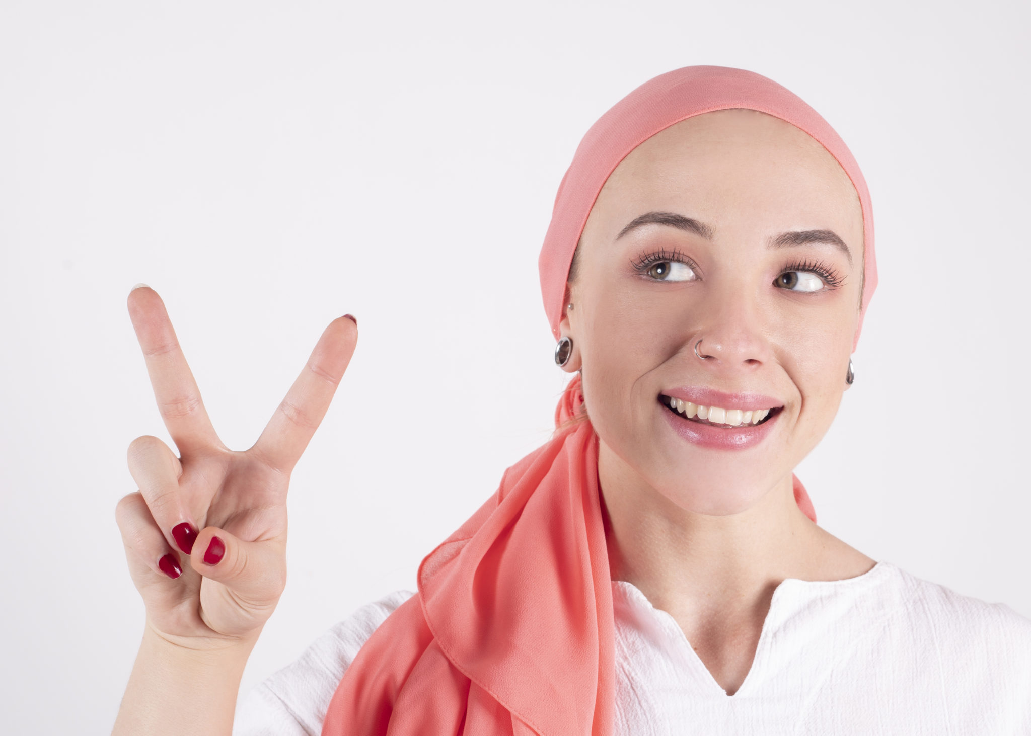 Beautiful Woman, Fighter Against Cancer, Wears A Pink Scarf, Makes Victory Symbol With Her Fingers