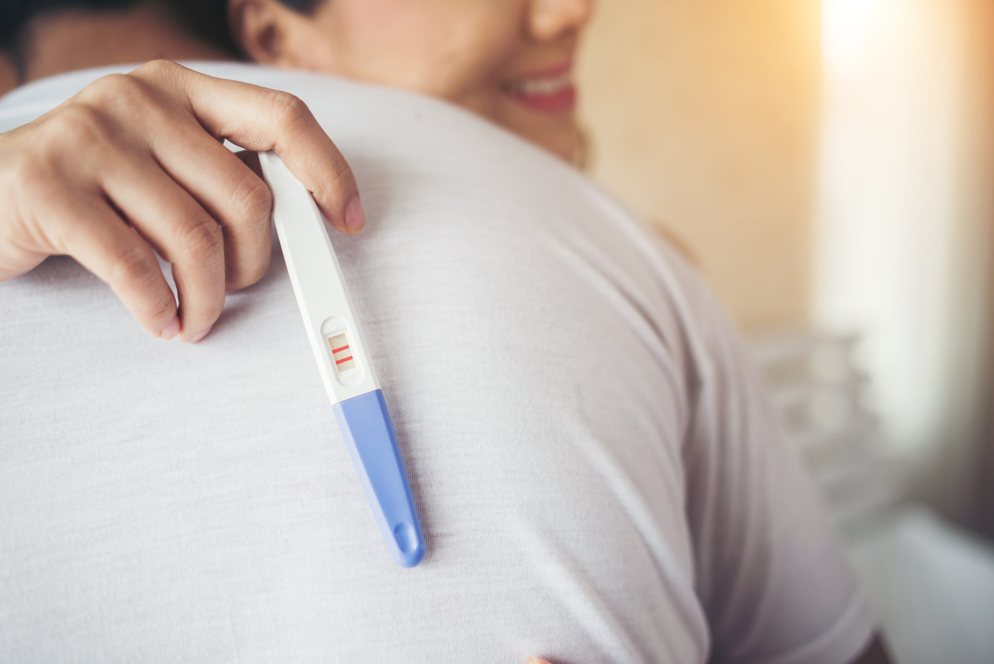 Happy Couple Smiling After Find Out Positive Pregnancy Test In B